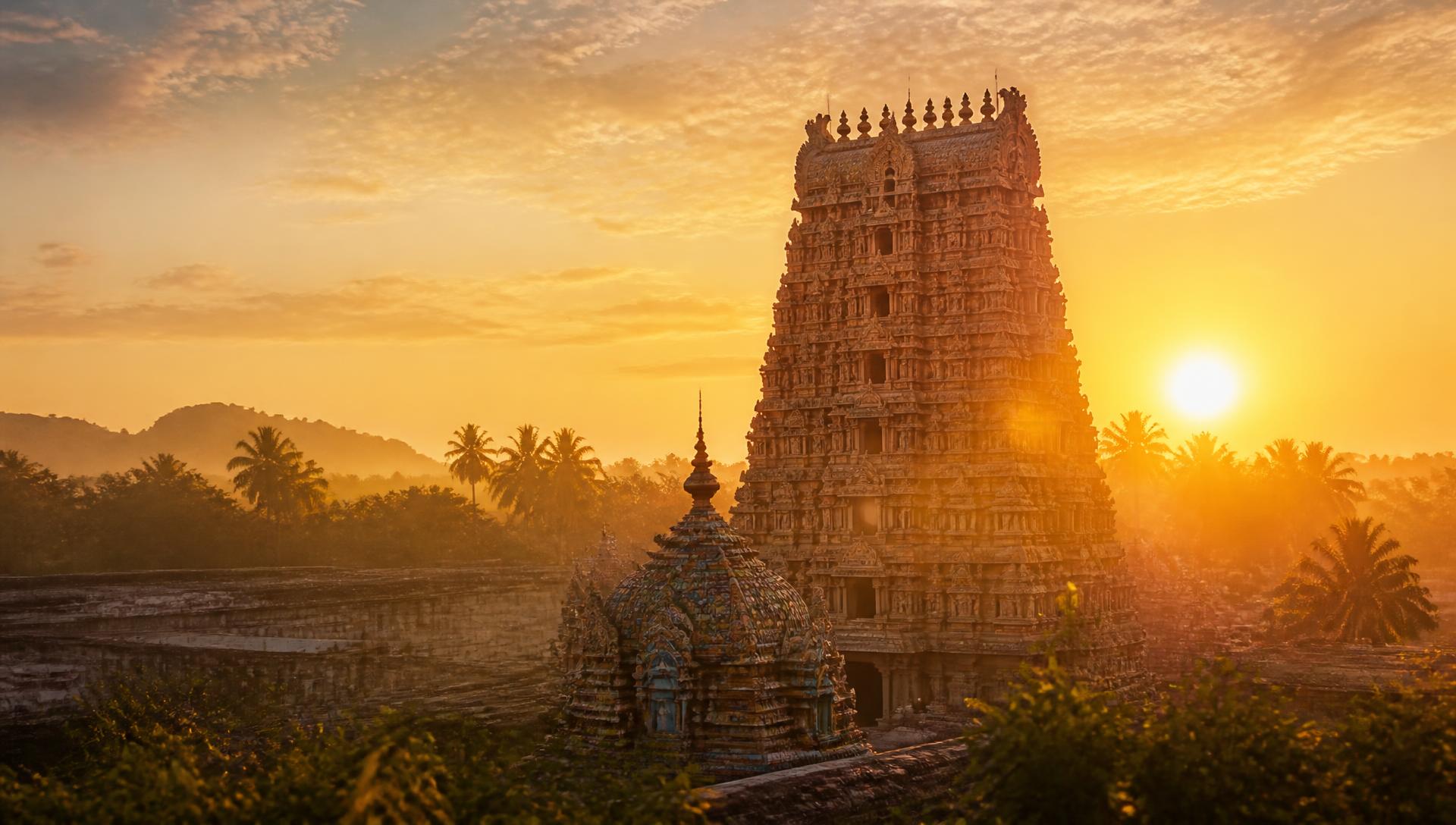 Temple gopuram glowing at sunrise
